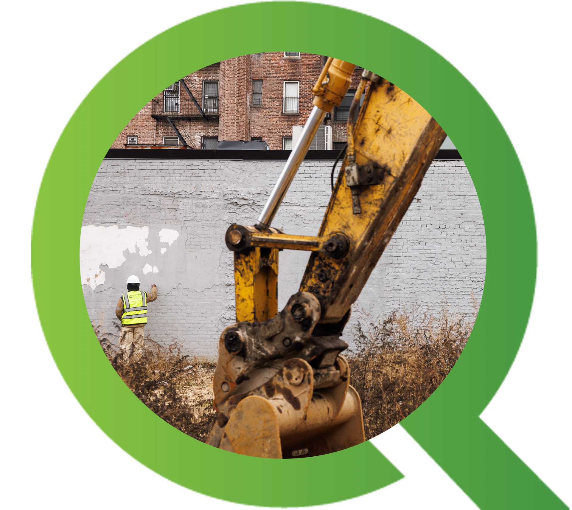Construction worker and excavator near building.