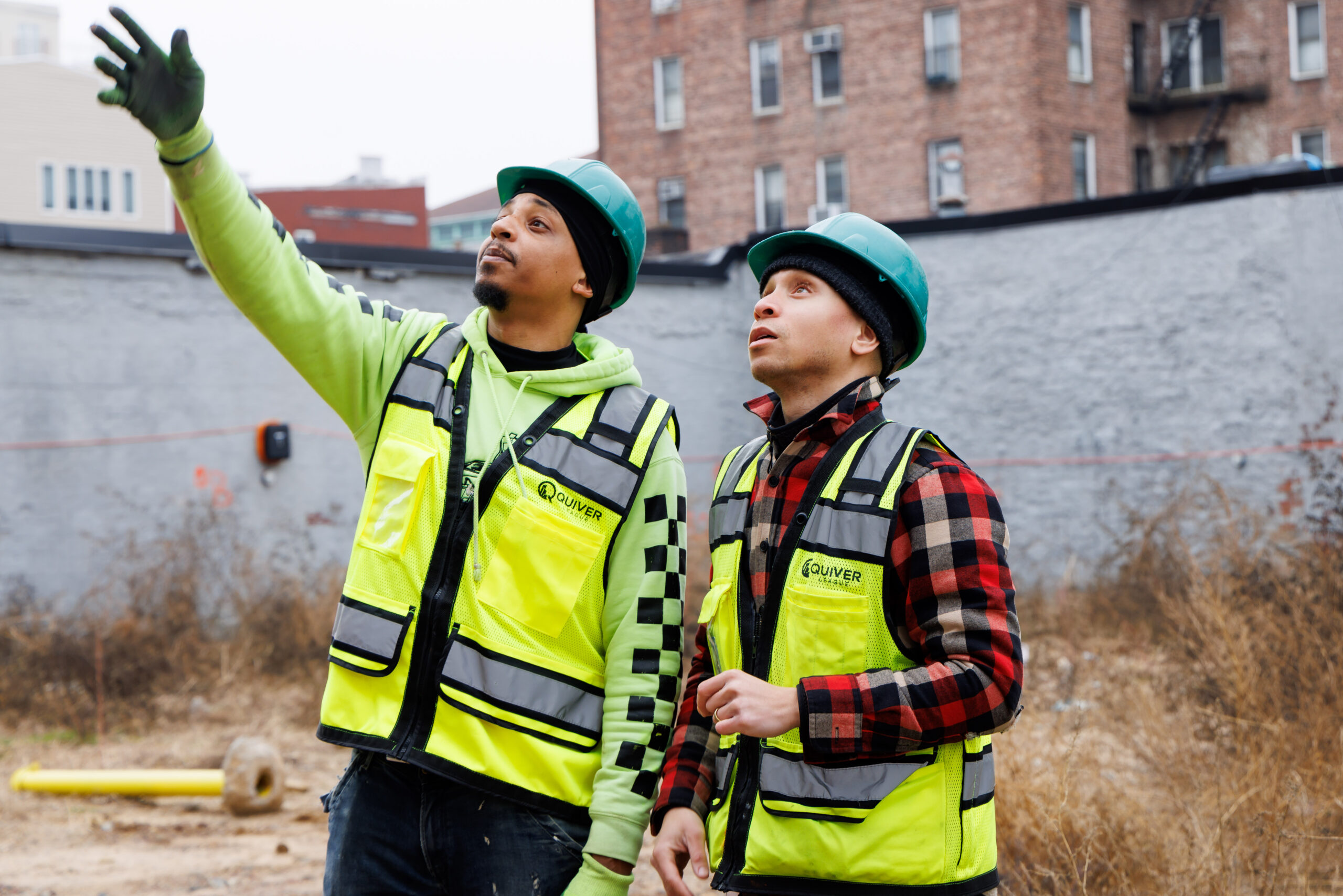 Construction workers inspecting site outdoor